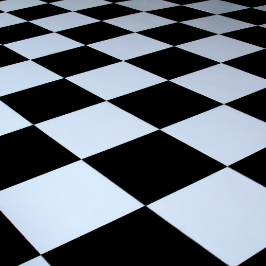 Close-up of a black and white checkered dance floor arranged in a diagonal pattern