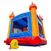 Side-angle view of the 13x13 Royal Crown Bouncer castle inflatable showing its turret towers and attached yellow air blower, on a white studio background.