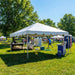 Beyond Tent White 15x20  with people and outdoor furniture in a park setting