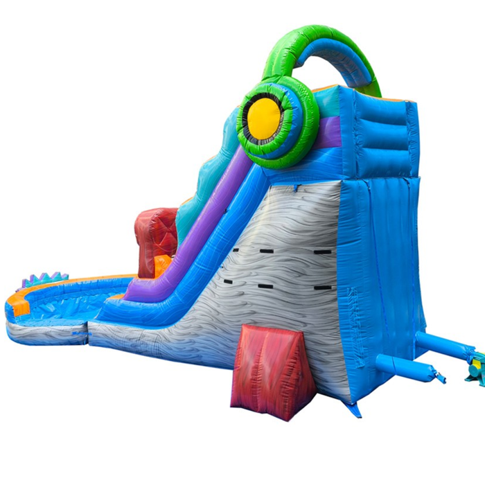 Studio product photo of the 18 foot Game Over wet and dry water slide from the back/side, on a white background, showing the gray rock-textured rear access tower with molded climbing grips leading up to the slide platform.