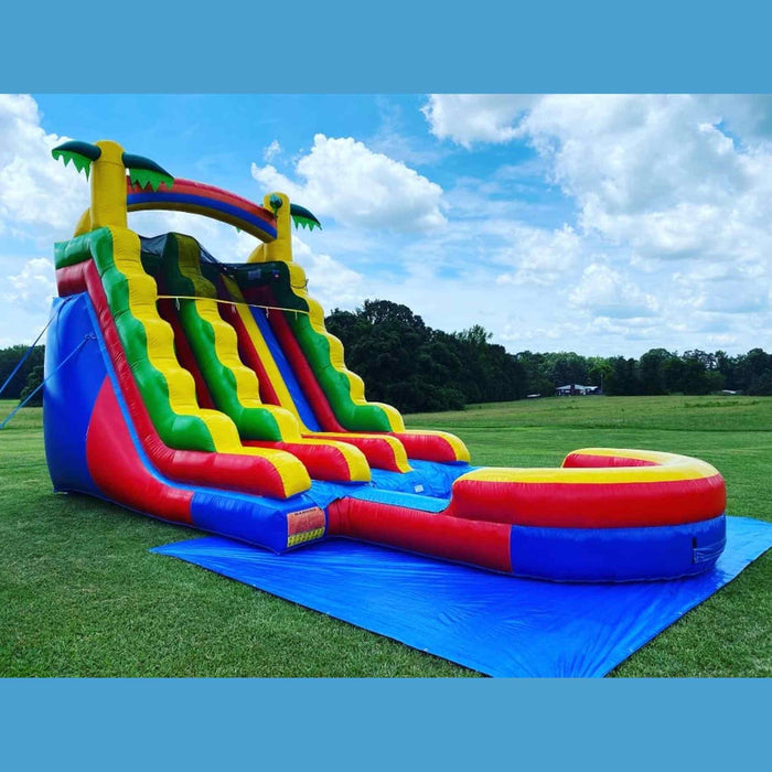 Close-up of Rainbow Dual Lane waterslide rainbow arch and entry platform — 18ft commercial-grade inflatable rental unit, Beyond Tent