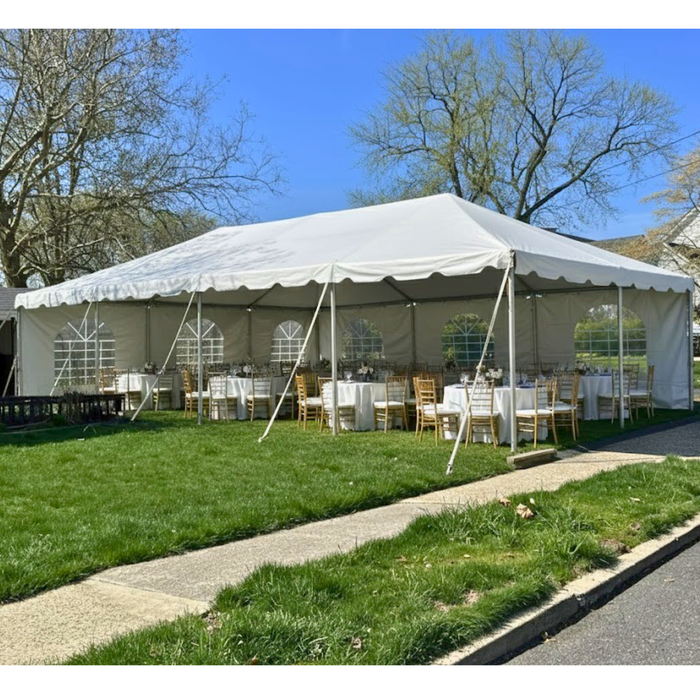 Beyond Tent 20x40 commercial West Coast frame tent - Elegant party setup with windowed sidewalls and interior seating for outdoor events