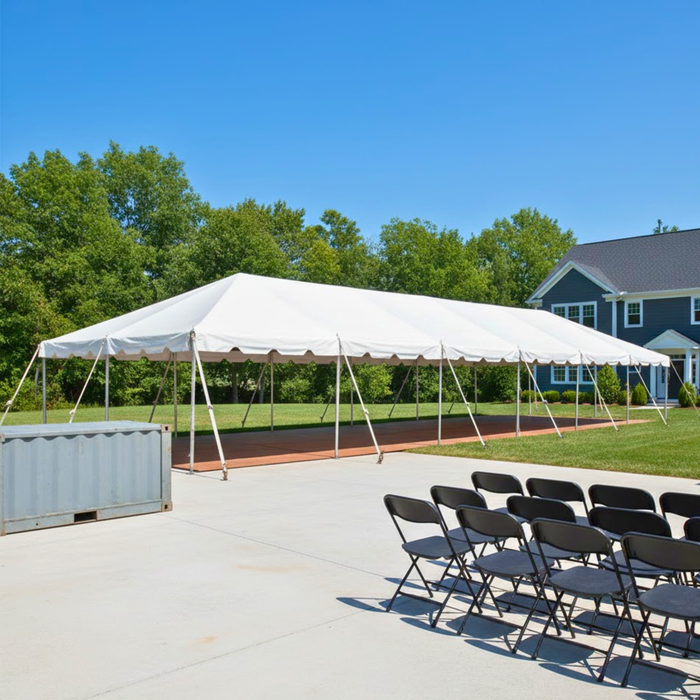 Beyond Tent 20x60 Classic Series West Coast Frame Tent setup outdoors with black folding chairs arranged in rows in front