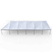 Beyond Tent 20x60 Classic Series West Coast Frame Tent side profile studio view showing the assembled white blockout vinyl canopy top and anodized aluminum legs on a solid white background