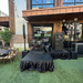 4'x4' Portable Stage Platform | Heavy-Duty Commercial Beyond Tent exclusive picture. 
Outdoor event setup with stage, chairs, and tables in an urban setting.