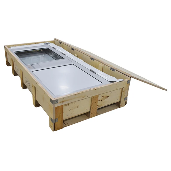 A large wooden shipping crate with a glass-top freezer or storage unit inside, photographed on a plain white background.