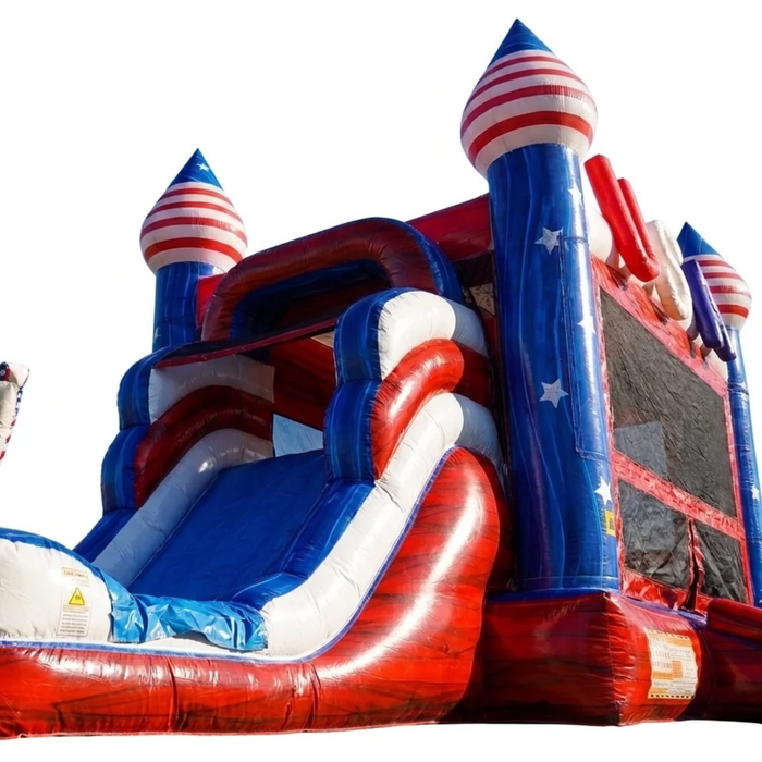 Low-angle close-up of the American Titan Wet and Dry Combo slide side, red marble vinyl rails, white trim, blue star-covered towers with red and white striped dome tops on white background