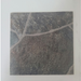 Beyond Tent Ash Stone Rolled Vinyl Flooring sample swatch shown at a close angle on a white surface, highlighting the stone-tile print pattern