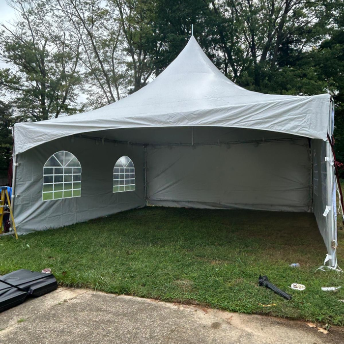 Beyond Tent 20x20 High Peak White outdoor tent with windowed sides on a grassy area