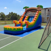 Colorful inflatable water slide on a tennis court with a clear blue sky.