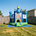 Colorful inflatable bounce house with 'Under the Sea' design in a backyard. Sunny day, wood fence. 