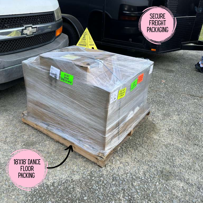 Pallet with wrapped items on a concrete surface, beyond Tent packing of commercial Dance Floor. 