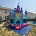 Beyond Tent Lightweight Hawaiian Castle Bounce House with Blower set up in a backyard next to a swimming pool, with a privacy fence and houses in the background