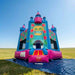 Beyond Tent Lightweight Hawaiian Castle Bounce House with Blower set up in an open grass field on a blue tarp, clear blue sky background