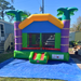 Beyond Tent Lightweight Palm Tree Bouncer front view set up on a blue tarp in a residential yard with a mobile home and stairs in the background, clear blue sky