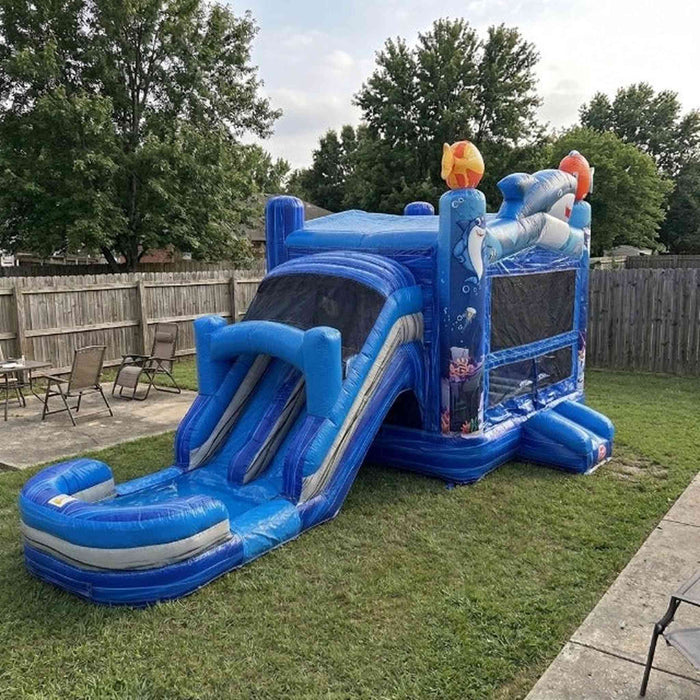 Ocean Shark Bounce House Combo Wet & Dry commercial inflatable slide set up on grass in a residential backyard