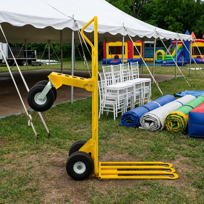 Beyond Tent picture of the dolly on grass with chiavari chairs, pole tent and inflatables behind. 