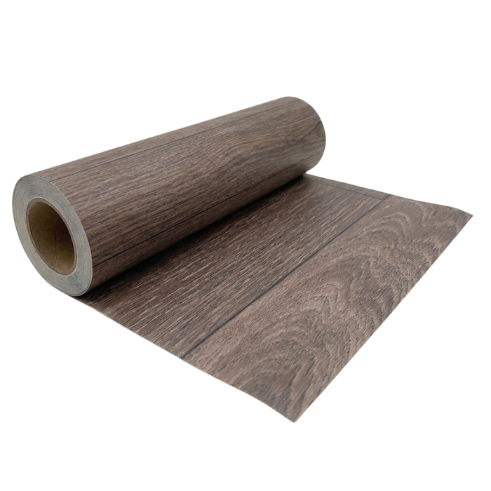 Partially unrolled roll of Rustic Oak vinyl flooring on a white background, showing the brown wood-look grain pattern and flexible roll format