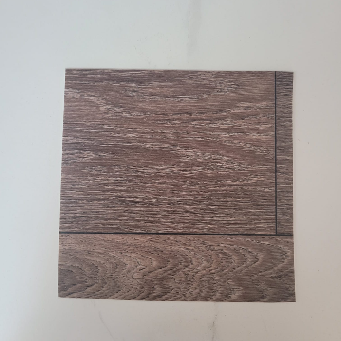 Rustic Oak vinyl flooring plank sample on a white background, showing the brown wood-look grain pattern and two plank seams
