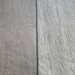 Close-up of the seam between two planks of Beyond Tent Silver Oak commercial-grade vinyl flooring, showing matched wood-grain texture