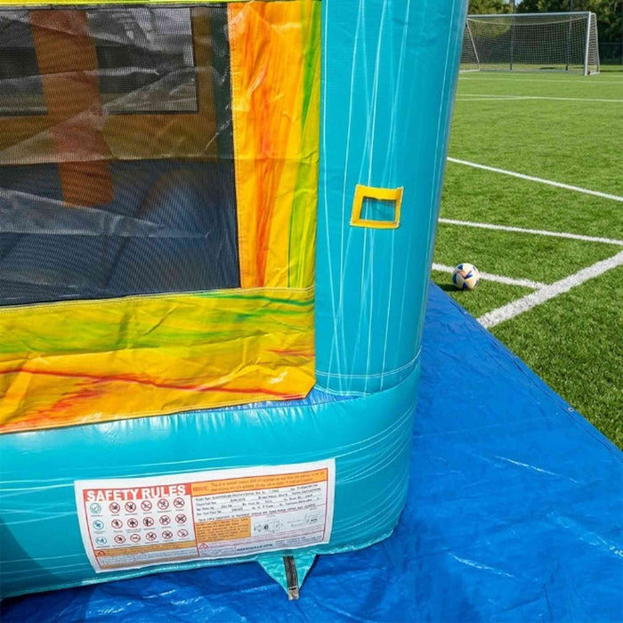 Beyond Tent Solar Dual Lane Combo corner safety rules label, teal and yellow marbled vinyl panel, set up on artificial turf soccer field with goal and ball in background